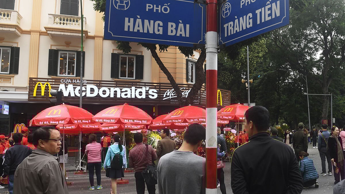 People stand around looking at the first McDonald’s fast food chain restaurant in the capital city, on its opening day in Hanoi on Saturday. Photo: AFP