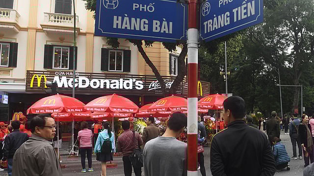 People stand around looking at the first McDonald’s fast food chain restaurant in the capital city, on its opening day in Hanoi on Saturday. Photo: AFP