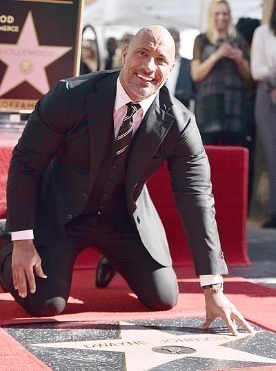 Actor Dwayne Johnson attends a ceremony honoring him with the 2,624th star on the Hollywood Walk of Fame on 13 December, 2017 in Hollywood, California. Alberto E. Photo: AFP