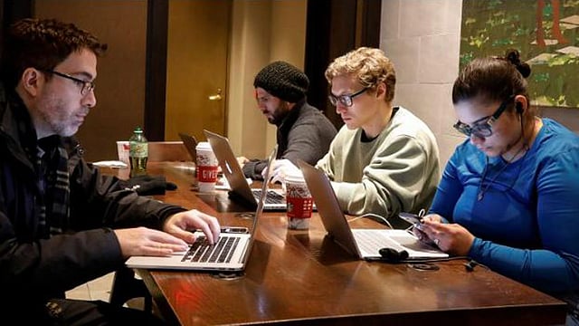 Customers use the internet at a Starbucks in the financial district in New York City, US, on 14 December 2017. Reuters