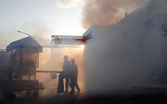 Worshippers carry statues of Guan Gong, the Chinese God of War during `Beehive Firecrackers` festival at the Yanshui district in Tainan, Taiwan on 1 March. Photo: Reuters