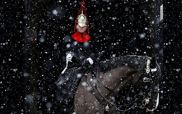 A guardsman sits on duty in the snow at Horse Guards Parade in London, 28 February. Photo: Reuters