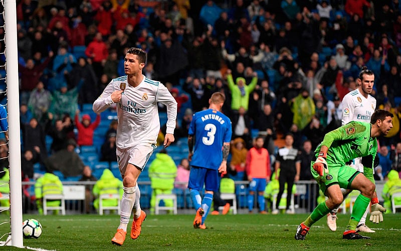 Real Madrid’s Portuguese forward Cristiano Ronaldo celebrates a goal during the Spanish league football match Real Madrid CF against Getafe CF at the Santiago Bernabeu stadium in Madrid on Saturday. Photo: AFP