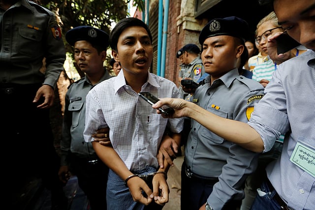 Detained Reuters journalist Kyaw Soe Oo speaks to the media after a court hearing in Yangon. Photo: Reuters
