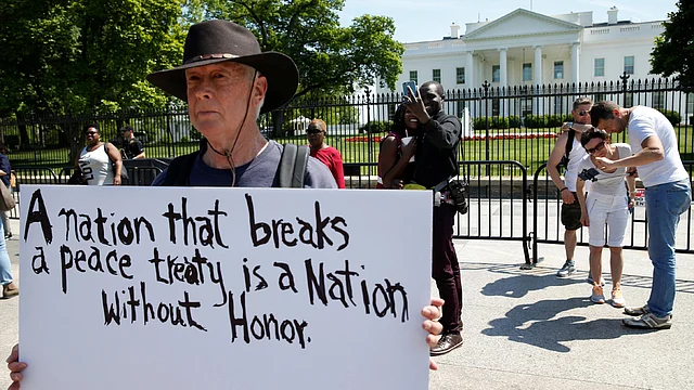 David Barrows protests outside of the White House as US president Donald Trump announces the US withdrawal from the Iran deal in Washington, US, on 8 May. Reuters