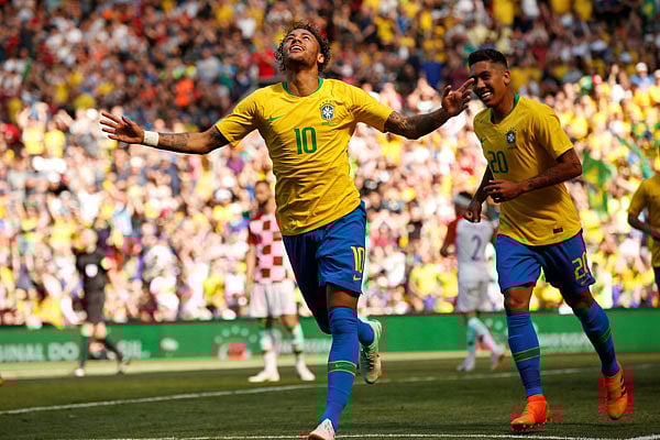 Brazil`s Neymar celebrates scoring their first goal with Roberto Firmino. Photo: Reuters.