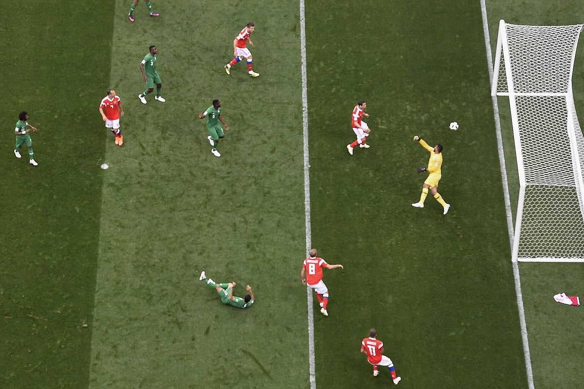 Russia`s midfielder Yuri Gazinskiy (08) heads to score the opener during the Russia 2018 World Cup Group A football match between Russia and Saudi Arabia at the Luzhniki Stadium in Moscow on 14 June 2018. Photo: AFP