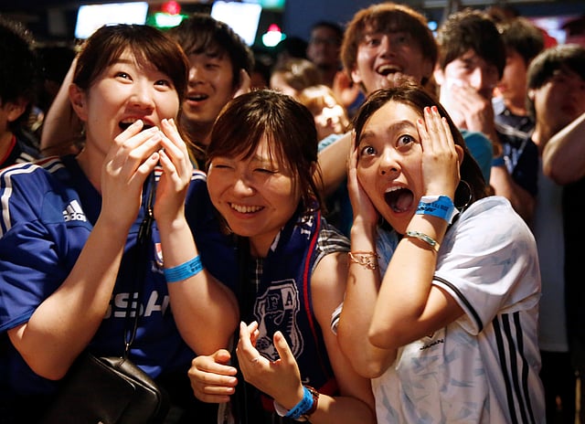 Japanese fans react as they watch a broadcast of the World Cup Group H soccer match Japan vs Poland, at a sports bar in Tokyo, Japan on 29 June 2018. Reuters