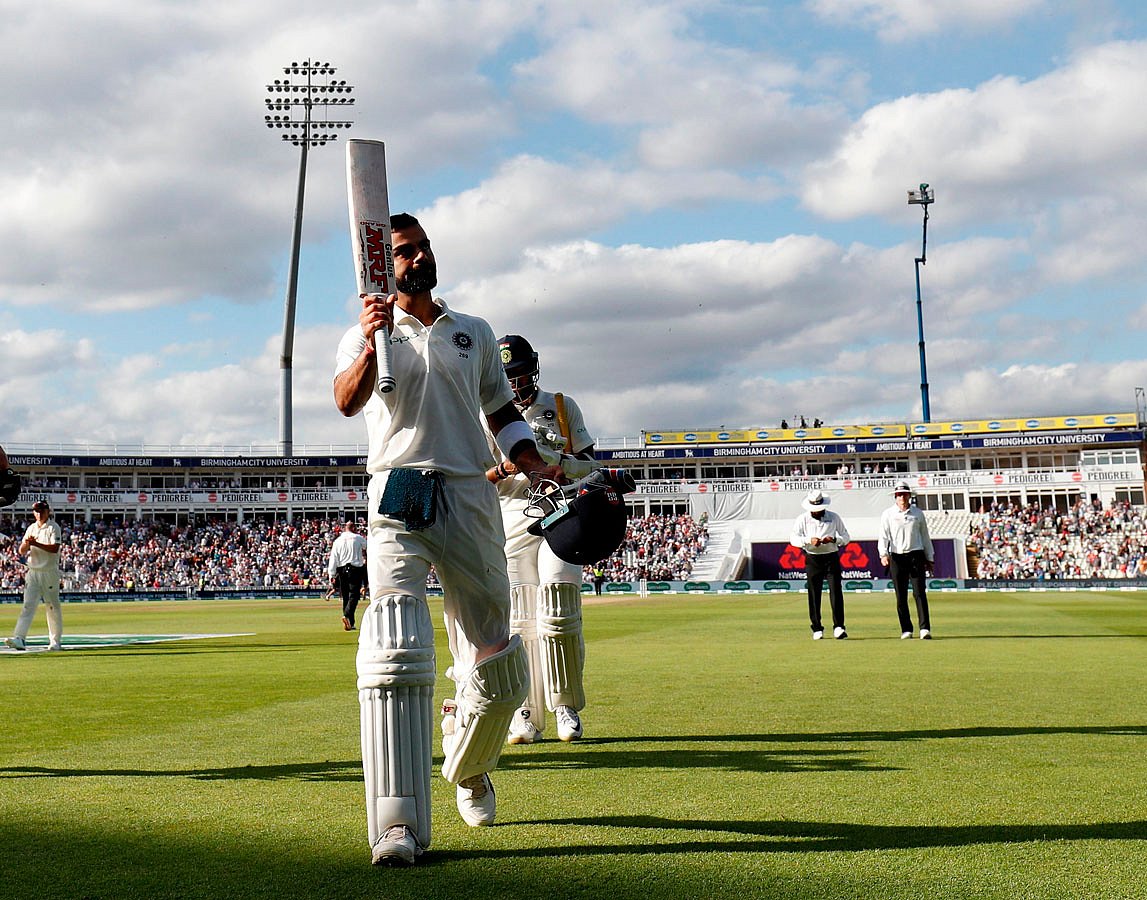 India`s Captain Virat Kohli walks back to the pavilion after losing his wicket for 149 runs on the second day of the first Test cricket match between England and India at Edgbaston in Birmingham, central England on 2 August 2018. -- AFP