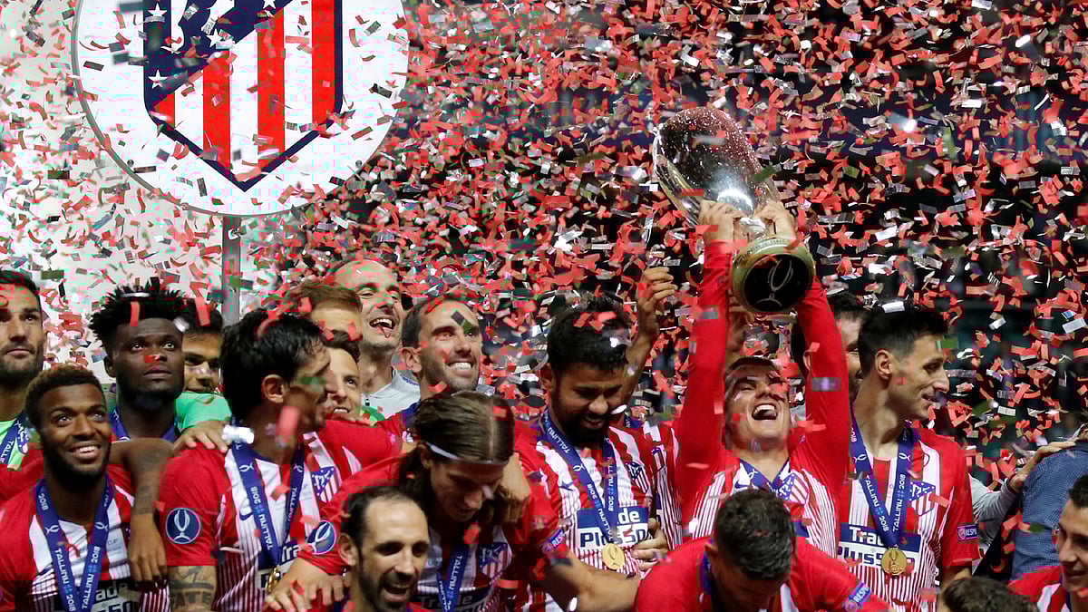 Atletico Madrid`s Antoine Griezmann celebrates with the trophy after winning the Super Cup beating Real Madrid at Lillekula Stadium, Tallinn, Estonia on 15 August 2018. Photo: Reuters