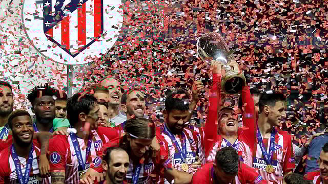 Atletico Madrid`s Antoine Griezmann celebrates with the trophy after winning the Super Cup beating Real Madrid at Lillekula Stadium, Tallinn, Estonia on 15 August 2018. Photo: Reuters
