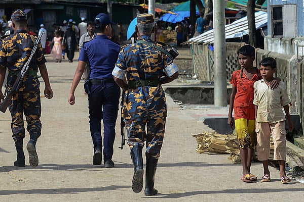 This photo taken on 18 July, 2018 shows police patrolling in a Rohingya refugee camp in Teknaf. Photo: AFP
