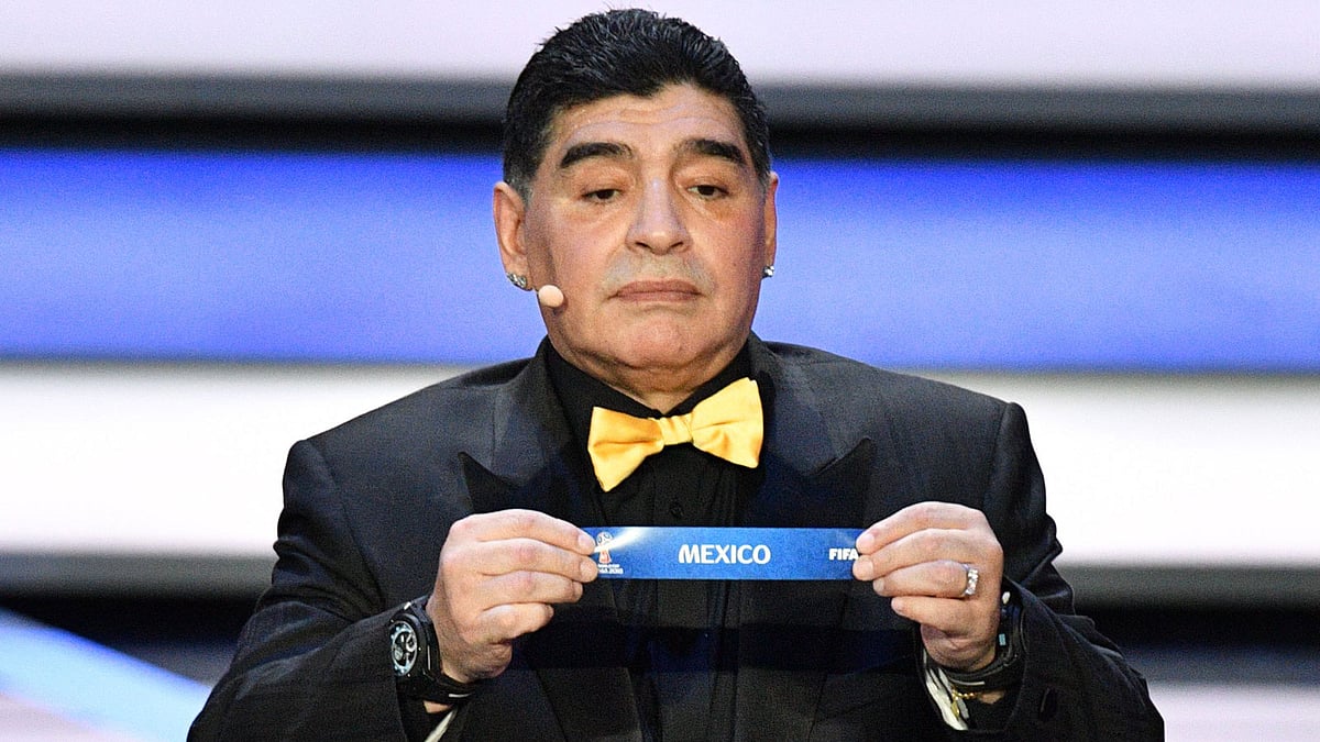 In this file picture taken on 1 December 2017 Argentina`s former midfielder Diego Maradona displays the slip of Mexico during the Final Draw for the 2018 FIFA World Cup football tournament at the State Kremlin Palace in Moscow. Photo: AFP