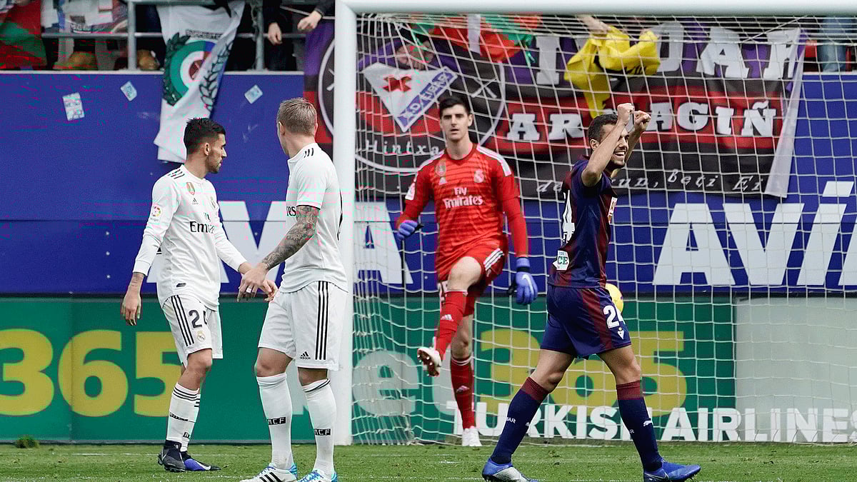 Eibar`s Joan Jordan celebrates their third goal as Real Madrid`s Thibaut Courtois and team mates look dejected in a La Liga match at Ipurua, Eibar, Spain on 24 November 2018. Photo: Reuters