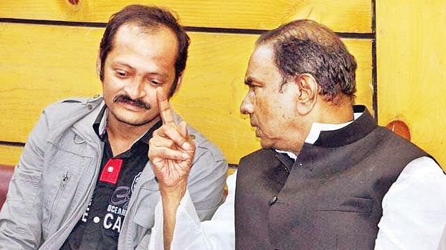 Ariful Rahman alias Tuhin, Adabor thana unit JL convener, greets AL-nominated candidate for Dhaka-13 constituency Sadek Khan at Shyamoli Club on Thursday. He has been implicated in a murder case. Photo: Collected