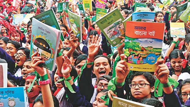 File photo of students showing their textbooks. Photo: UNB