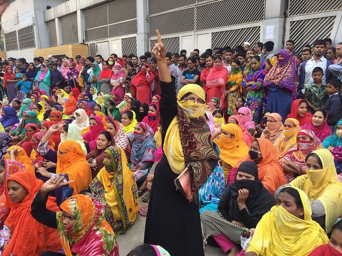 Readymade garment workers are seen chanting slogans from a demonstration organised in Savar for the fourth consecutive day on Wednesday demanding implementation of minimum wage structure. Photo: UNB