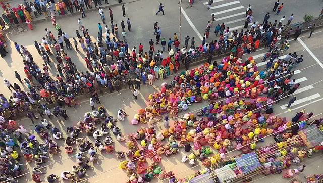 Readymade garment workers hold a demonstration organised in Savar for the fourth consecutive day on Wednesday demanding implementation of minimum wage structure. Photo: UNB