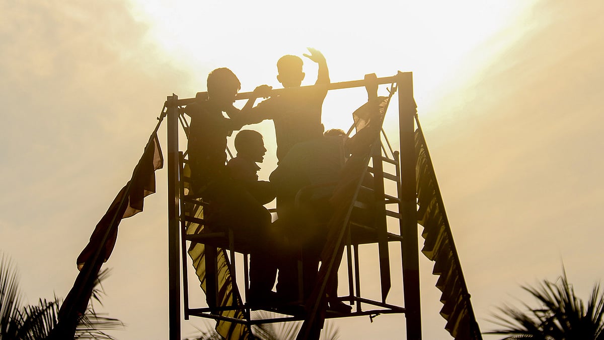 Children riding a `nagordola` at a book fair at the Public Library compound at Khulna on 2 February. Photo: Saddam Hossain