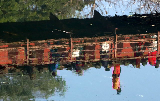 Reflection of people crossing a bridge in the water of river Karatoa at Chelopara in Bogura on 3 Februay. Photo: Soel Rana