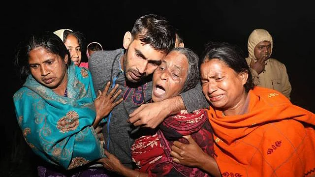 Jahalam greeted by mother and sister upon returning home in Nagarpur, Tangail early Monday. Photo: Dipu Malakar