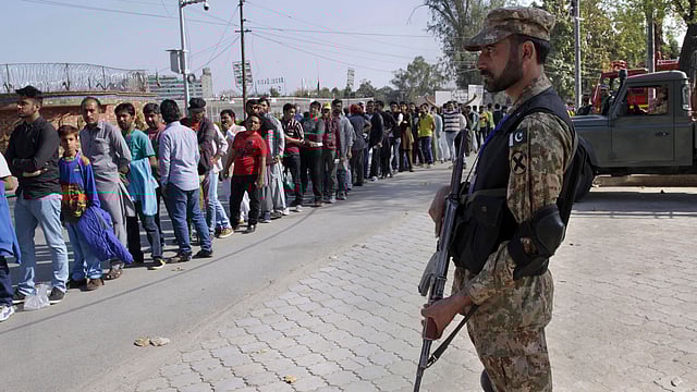 In this 5 March 2017 file photo a Pakistan army soldier stands guard during the Pakistan Super League match at Gaddafi stadium in Lahore, Pakistan. AP File Photo