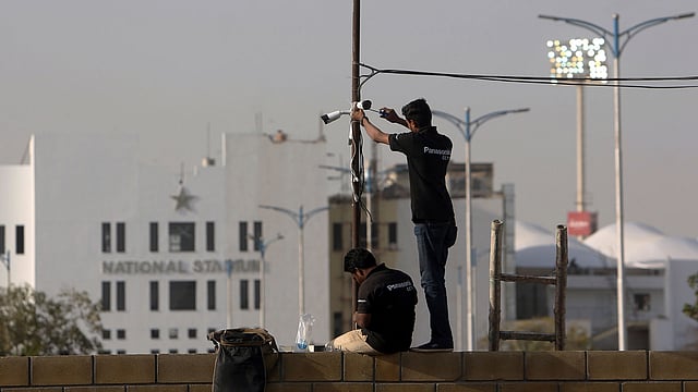 In this 9 February 2019, photo, Pakistani technician fix security cameras at National Stadium ahead of upcoming Pakistan Super League in Karachi, Pakistan. Photo: AP