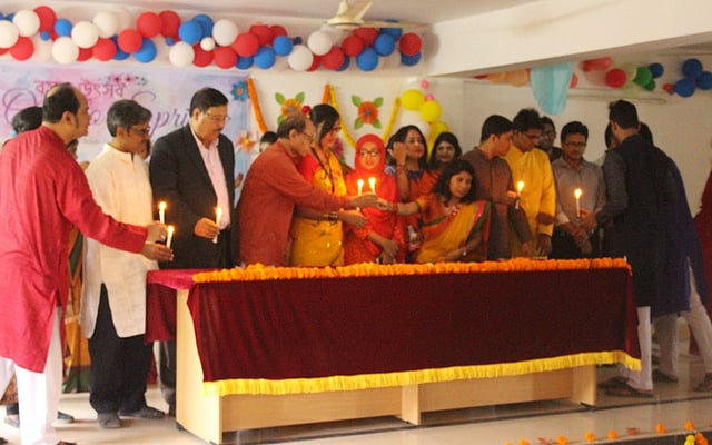 Faculty members of the English department at City University light candles on the first day of Spring in the Bengali month Falgun at the main campus of the university at Savar, Dhaka on 13 February. Photo: Collected