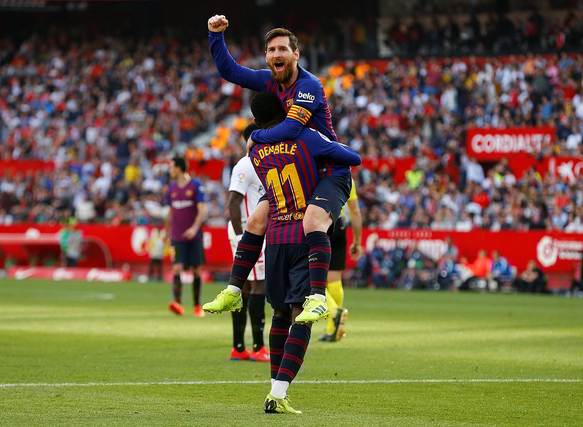 Barcelona`s Lionel Messi celebrates scoring their second goal with Ousmane Dembele in a La Liga match against Sevilla at Ramon Sanchez Pizjuan, Seville, Spain on 23 February 2019. Photo: Reuters