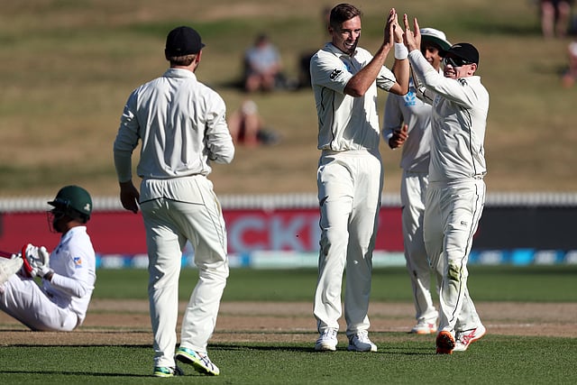 New Zealand`s Tim Southee (C) celebrates the wicket of Tamim Iqbal of Bangladesh (L) during day three of the first cricket Test match between New Zealand and Bangladesh at Seddon Park in Hamilton on 2 March 2019. Photo: AFP