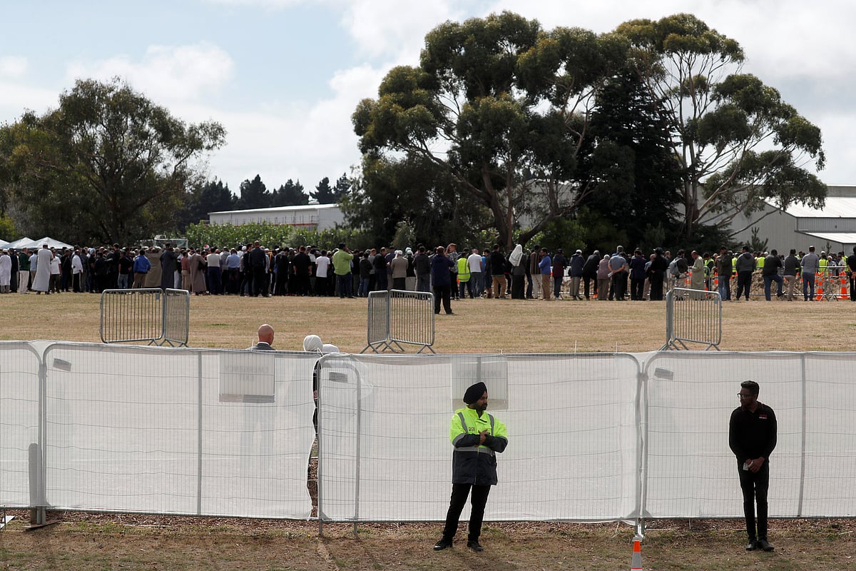 People attend the burial ceremony for the victims of the mosque attacks at the Memorial Park Cemetery in Christchurch, New Zealand on 20 March. Reuters File Photo