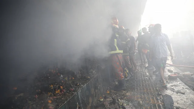 Fire service men work to douse the blasé. Photo: Abdus Salam