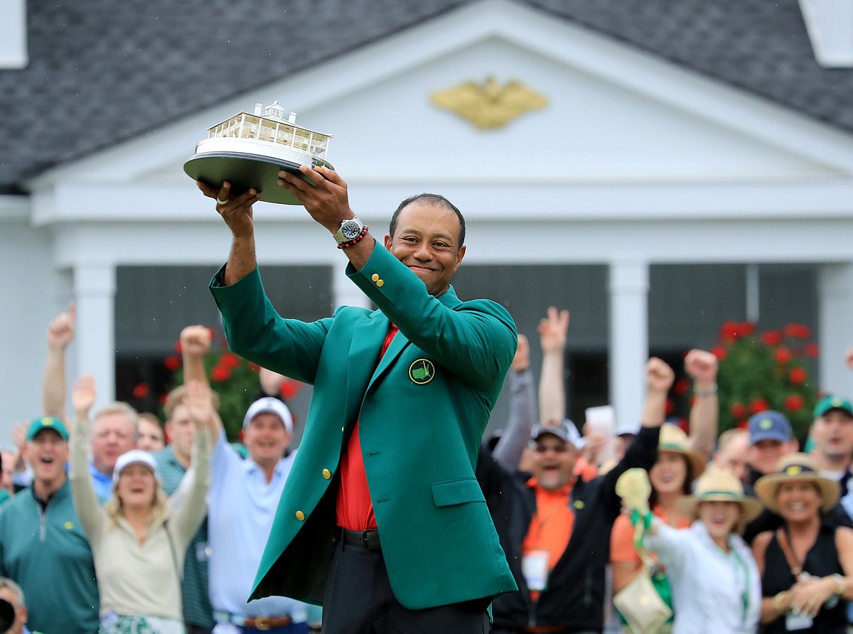 In this file photo taken on 13 April 2019 Tiger Woods of the United States wears The Green Jacket and holds The Masters Trophy after his historic one shot win during the final round of the 2019 Masters Tournament at Augusta National Golf Club on 14 April 2019 in Augusta, Georgia. AFP