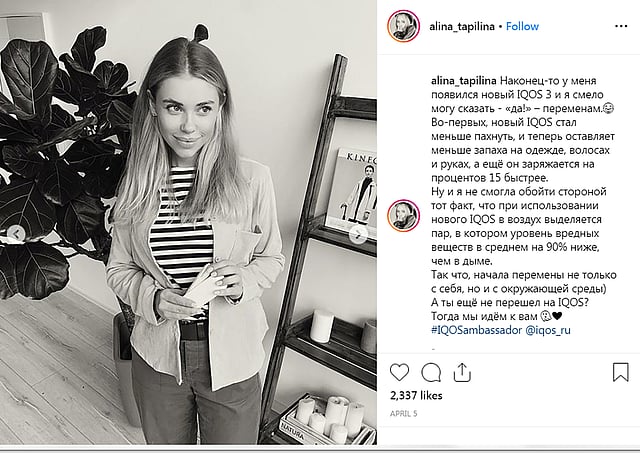 Alina Tapilina, whose social media profile says she is 21 years old, holds a `heated tobacco` iQOS device as part of a campaign by Philip Morris International to market the device in an Instagram post on 5 April. Photo: Reuters