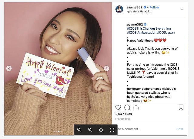 Ayame Tachibana, a 27 year old Japanese model who is marketing a new cigarette alternative from Philip Morris International, shows off a Valentine’s Day card for the iQOS “heated tobacco” device on her Instagram account on 8 February. Photo: Reuters