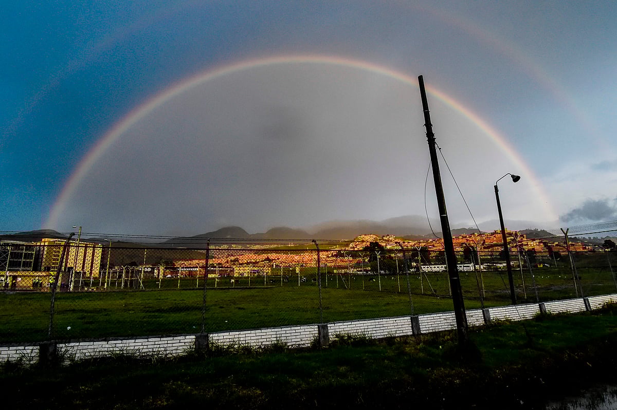 A rainbow is seen above La Picota jail where Colombian Farc political party member Jesus Santrich awaits to be released in Bogota, on 16 May 2019. Photo: AFP