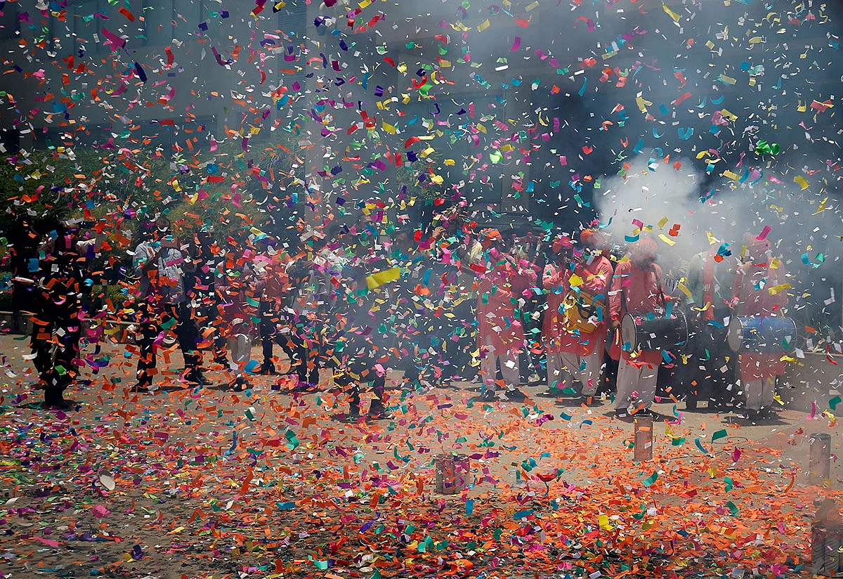 Supporters of Bharatiya Janata Party (BJP) celebrate after learning of initial poll results outside the party office in Gandhinagar, India, on 23 May 2019. Reuters
