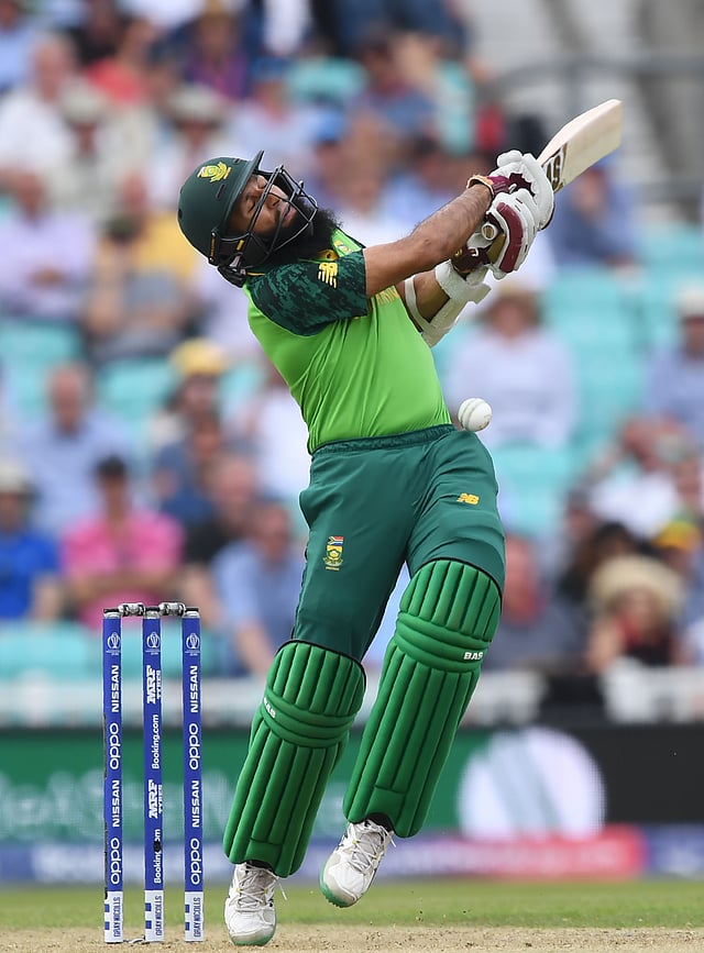 South Africa`s Hashim Amla reacts as he is hit on the head by a delivery from England`s Jofra Archer during the 2019 Cricket World Cup group stage match between England and South Africa at The Oval in London on 30 May, 2019. Photo: AFP