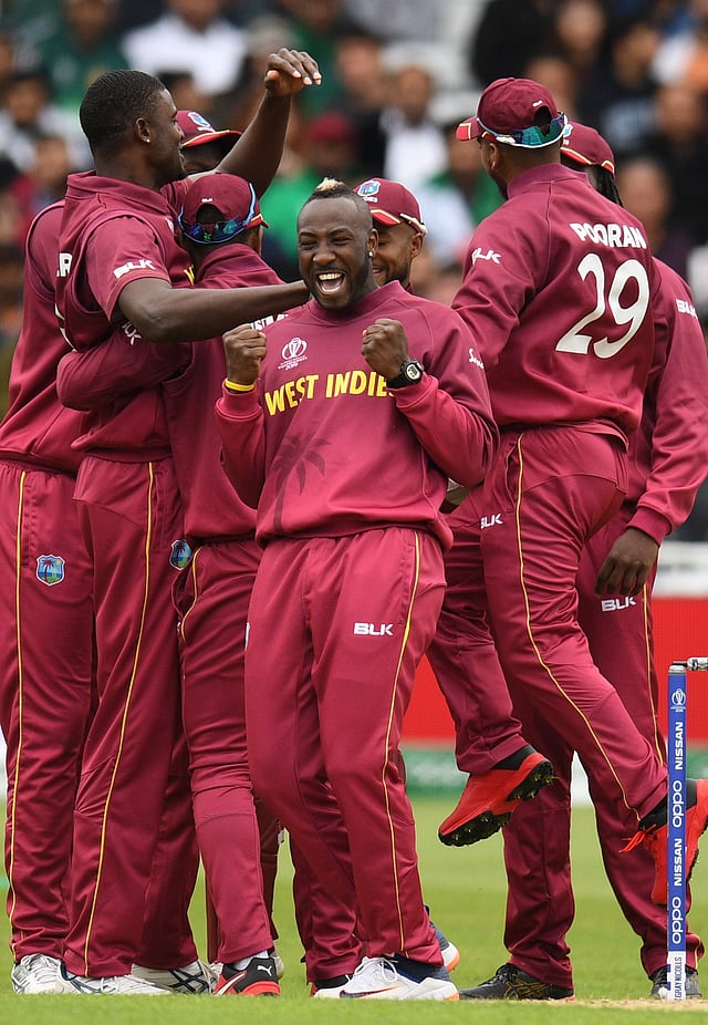 West Indies players including West Indies` Andre Russell (C) and West Indies` captain Jason Holder (L) celebrate taking the wicket of Pakistan`s captain Sarfaraz Ahmed during the 2019 Cricket World Cup group stage match between West Indies and Pakistan at Trent Bridge in Nottingham, central England, on 31 May 2019. Photo: AFP