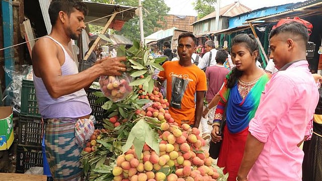 Eid holidays are not over. People visit their relatives with lychyees. This photo is taken from Daulatdia ferry ghat in Rajbari on 8 June. Photo: M Rashedul Haque