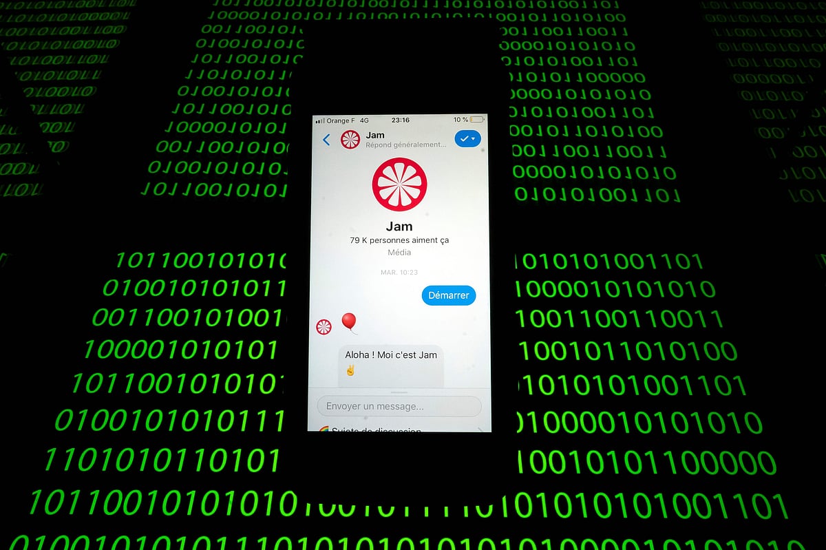 This file photo taken on 28 February 2019 shows the `Jam` chat bot displayed on a smartphone and a binary code displayed by a tablet in Paris. Some traditional news media as well as start-ups rely on `chatbots`, computer programs that provide knowledge online based on a fun conversation with a connected audience. The `Jam` chat bot for example is a robot which tells stories to enrich the news and to strengthen general knowledge. Photo: AFP