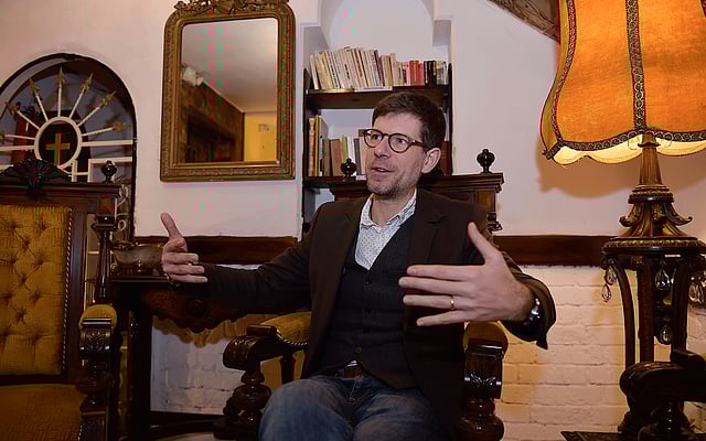 In this file photo taken on 30 January 2019 French forensic doctor Philippe Charlier speaks during an interview with AFP at a hotel in Quito. Photo: AFP