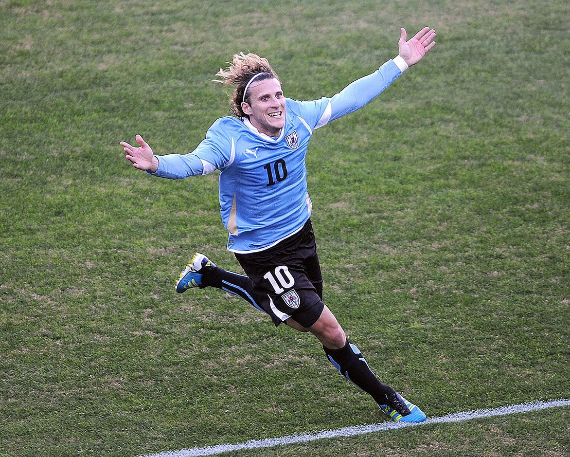 In this file picture taken on 14 July 2011 Uruguayan forward Diego Forlan celebrates after scoring against Paraguay during the final of the 2011 Copa America football tournament, at the Monumental stadium in Buenos Aires. Photo: AFP