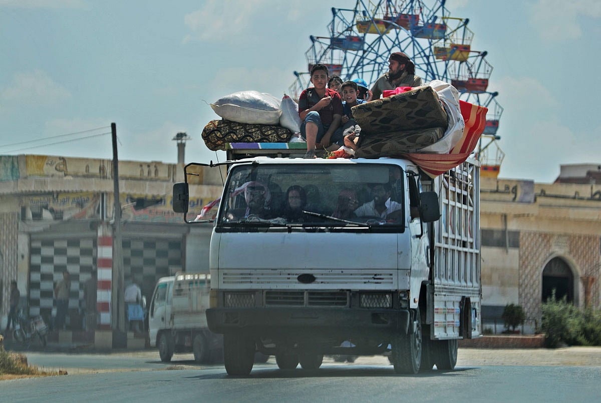 Syrian civilians flee on August 22, 2019 a conflict zone in Syria`s rebel-held northwestern region of Idlib, where government bombardment has killed hundreds since late April, near Maar Shurin on the outskirts of Maaret al-Numan. Photo: AFP
