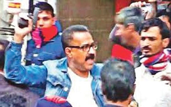 Niazul Islam, an aide of Shamim Osman, brandishes a pistol while carrying out attacks on Narayanganj mayor Selina Hayat Ivy and her supporters. This photo was taken on 16 January 2018.