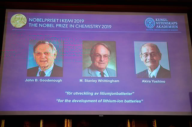 A screen displays the portraits of the laureates of the 2019 Nobel Prize in Chemistry (L-R) John Goodenough of US, Britain`s Stanley Whittingham and Japan`s Akira Yoshino during a press conference at the Royal Swedish Academy of Sciences in Stockholm, Sweden, on 9 October 2019. Photo: AFP