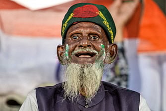 A supporter of the Bangladesh`s team cheers before the second T20 international cricket match of a three-match series between Bangladesh and India at Saurashtra Cricket Association Stadium in Rajkot on 7 November. Photo: AFP
