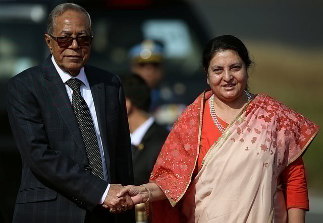 Bangladeshi president Abdul Hamid shakes hand with Nepal`s president Bidhya Devi Bhandari upon his arrival at Tribhuvan International Airport in Kathmandu, Nepal on 12 November 2019. Photo: Reuters