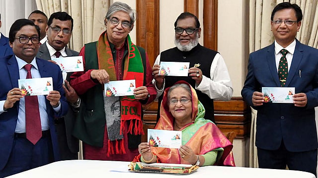 Prime minister Sheikh Hasina on Monday released a commemorative postage stamp, a first-day cover and a data card, marking the 49th Victory Day. Photo: PID