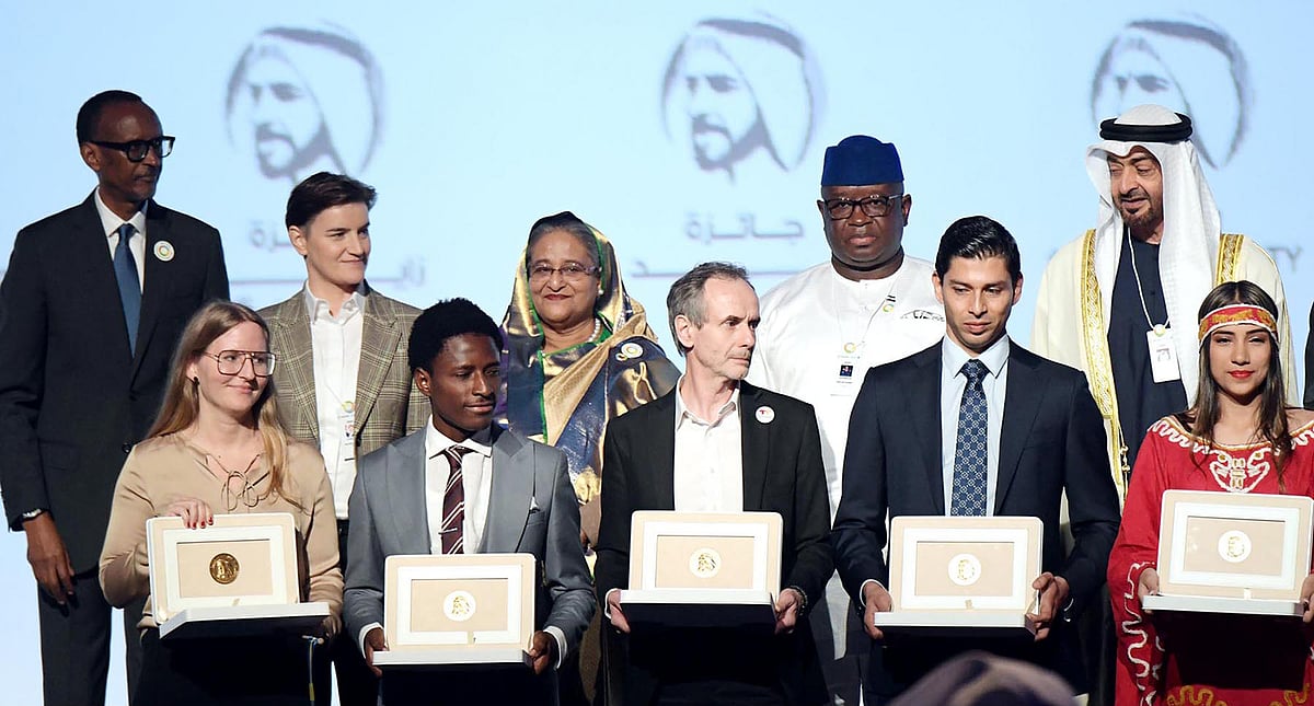 Prime minister Sheikh Hasina other leaders pose with the winners of Zayed Sustainability Prize at ICC Hall of Abu Dhabi National Exhibition on Monday. Photo: PID